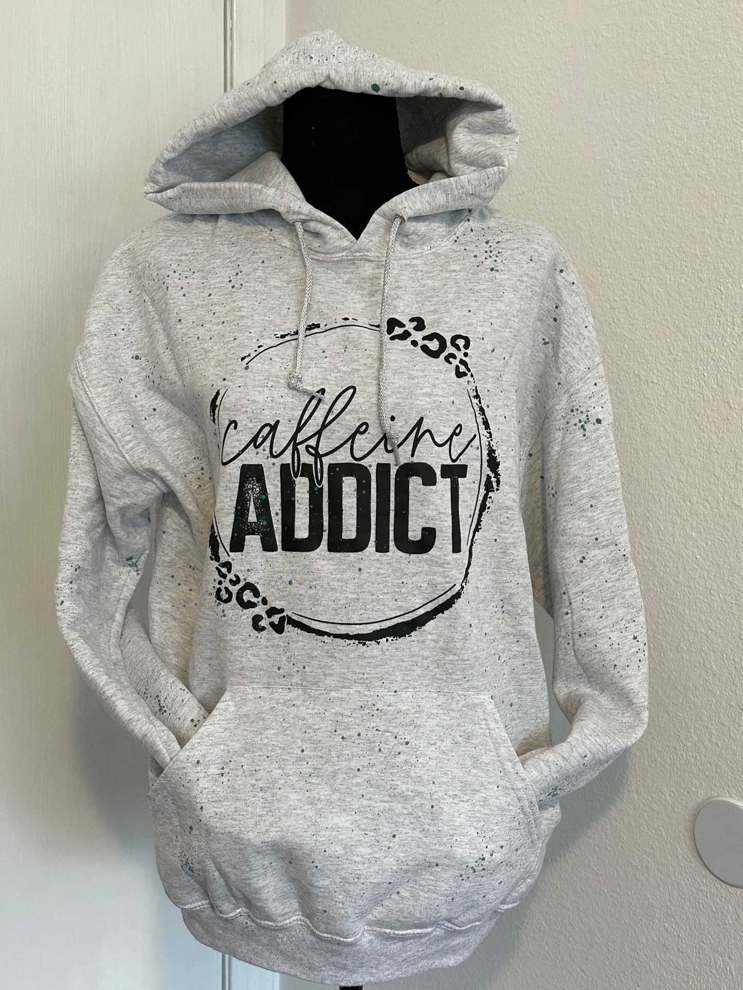 caffeine addict hooded sweatshirt with teal splatter