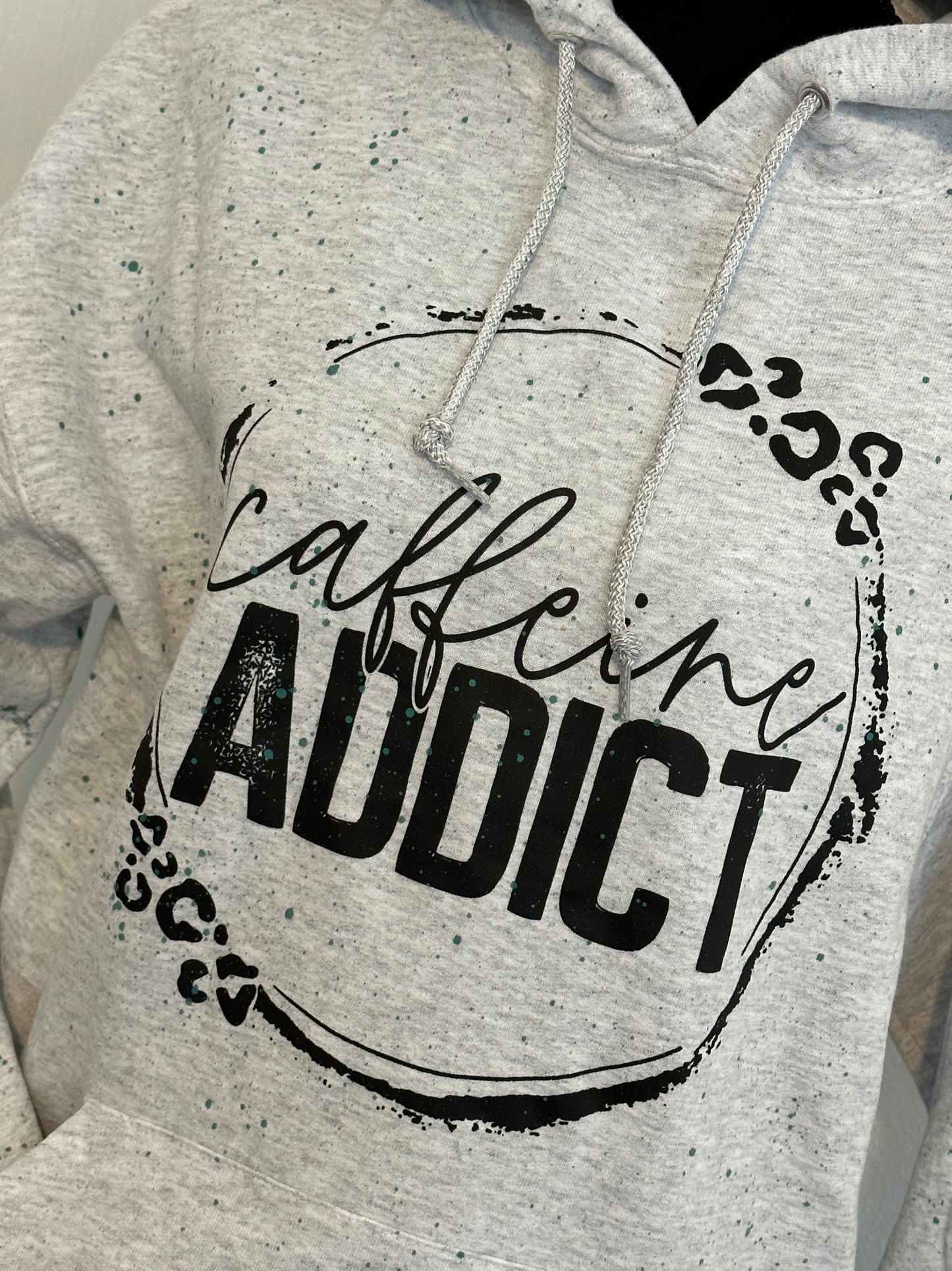 caffeine addict hooded sweatshirt with teal splatter